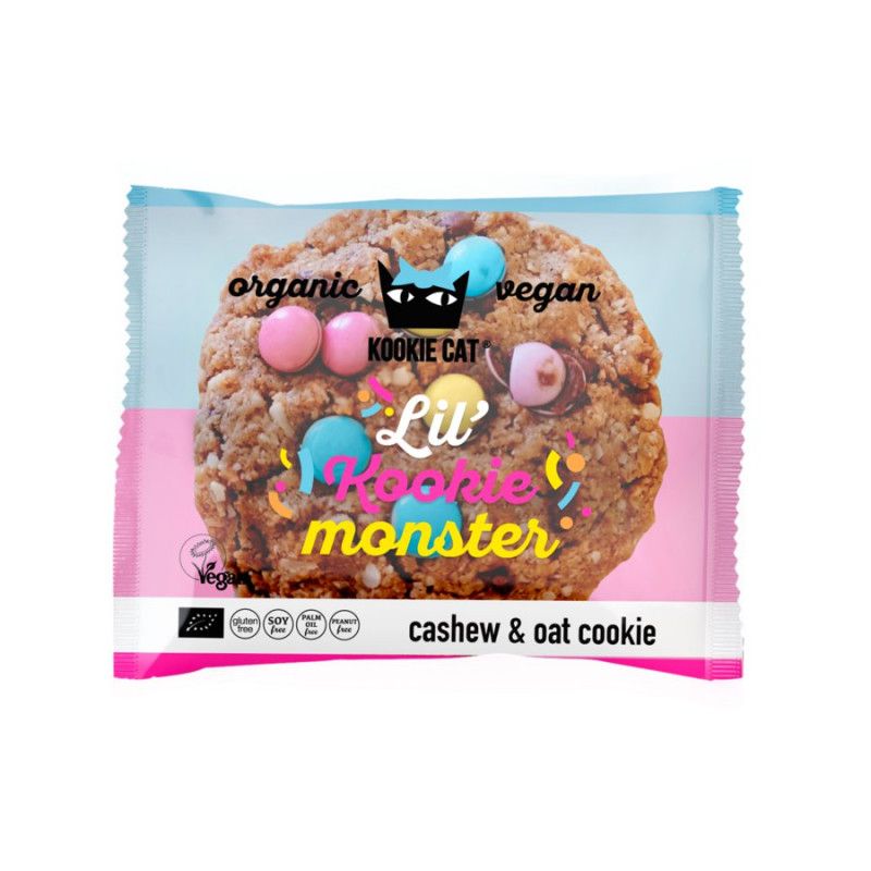 Keks in Verpackung. Aufschrift: Kookie Cat Lil' Kookie Monster, vegan, Bio. Mit Cashew- und Haferflocken. Rosa, blau und gelbe Dekoration.