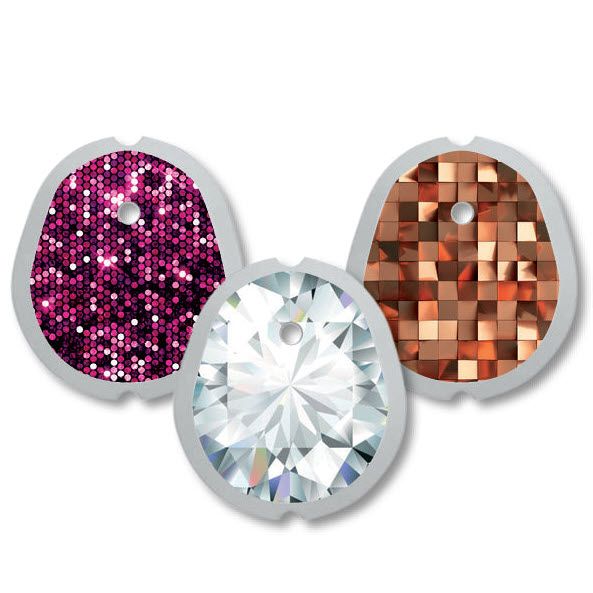 Drei Aufkleber für medizinische Geräte. Designs: pinke Glitzer, Diamant-Optik, kupferfarbene Quadrate. Alle mit Loch und grauem Rand.