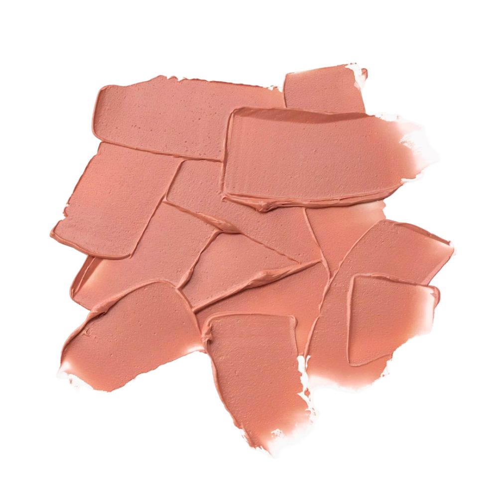 Haufen von Lippenbalsam-Strichen. Farbton: Rosa-Nude. Auf weißem Hintergrund. Textur sichtbar.