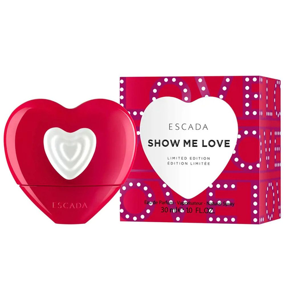 Roter Flakon in Herzform mit weißem Herz. Daneben Schachtel mit Schriftzug "SHOW ME LOVE" und "ESCADA".