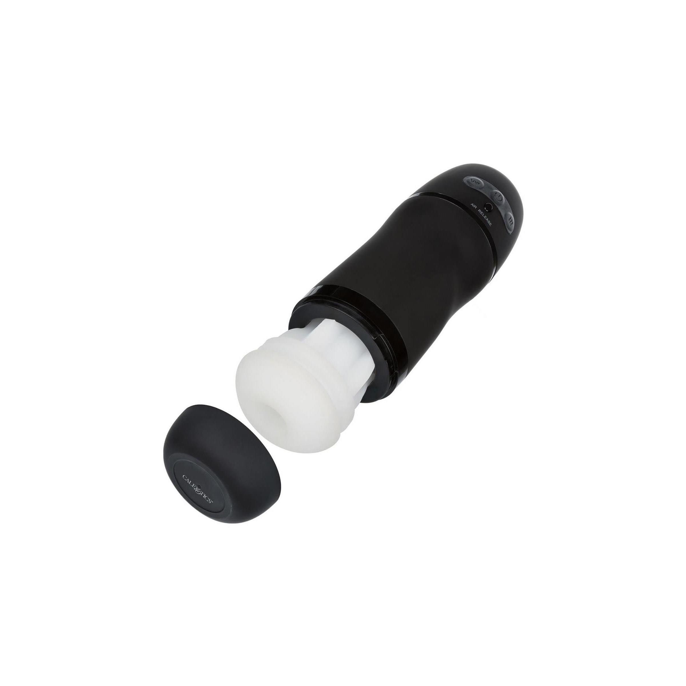 Schwarzes Gerät mit weißem Einsatz und abgenommenem Deckel. Zylindrische Form.