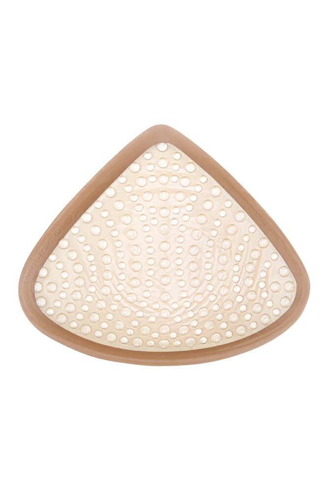 Brustprothese mit Holzrahmen. Innenfläche mit kleinen, kreisförmigen Aussparungen. Dreieckige Form.