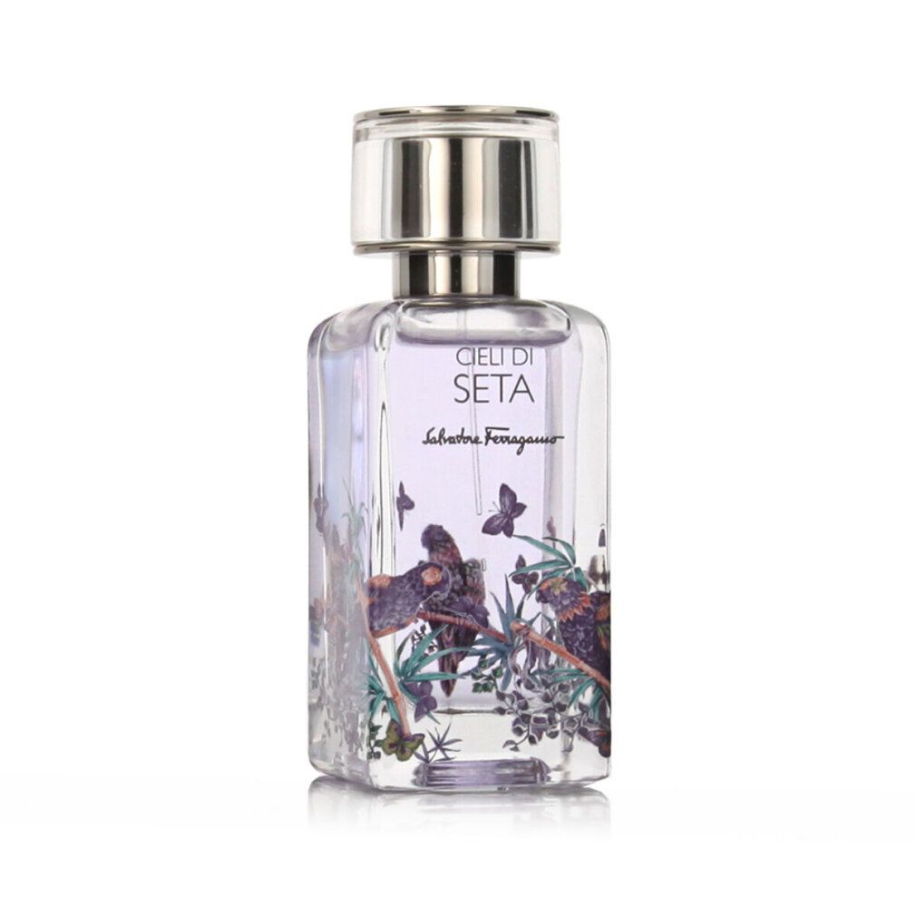Salvatore Ferragamo Cieli di Seta Eau de Parfum Flakon mit silbernem Verschluss und lila Schmetterlings- und Vogelmotiv.