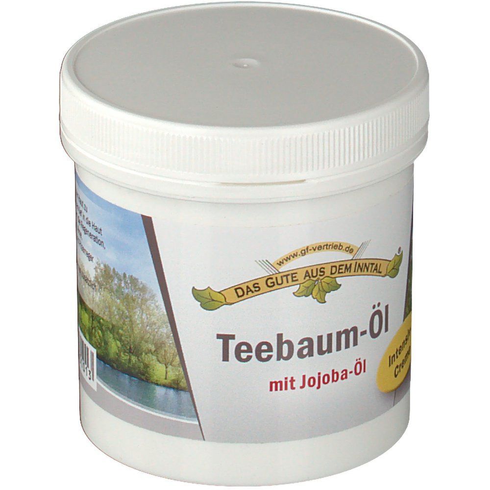 Weißer Tiegel mit Deckel. Aufschrift: Teebaum-Öl mit Jojoba-Öl. Gelbes Etikett: Intensiv Creme. Logo: Das Gute aus dem Inntal.