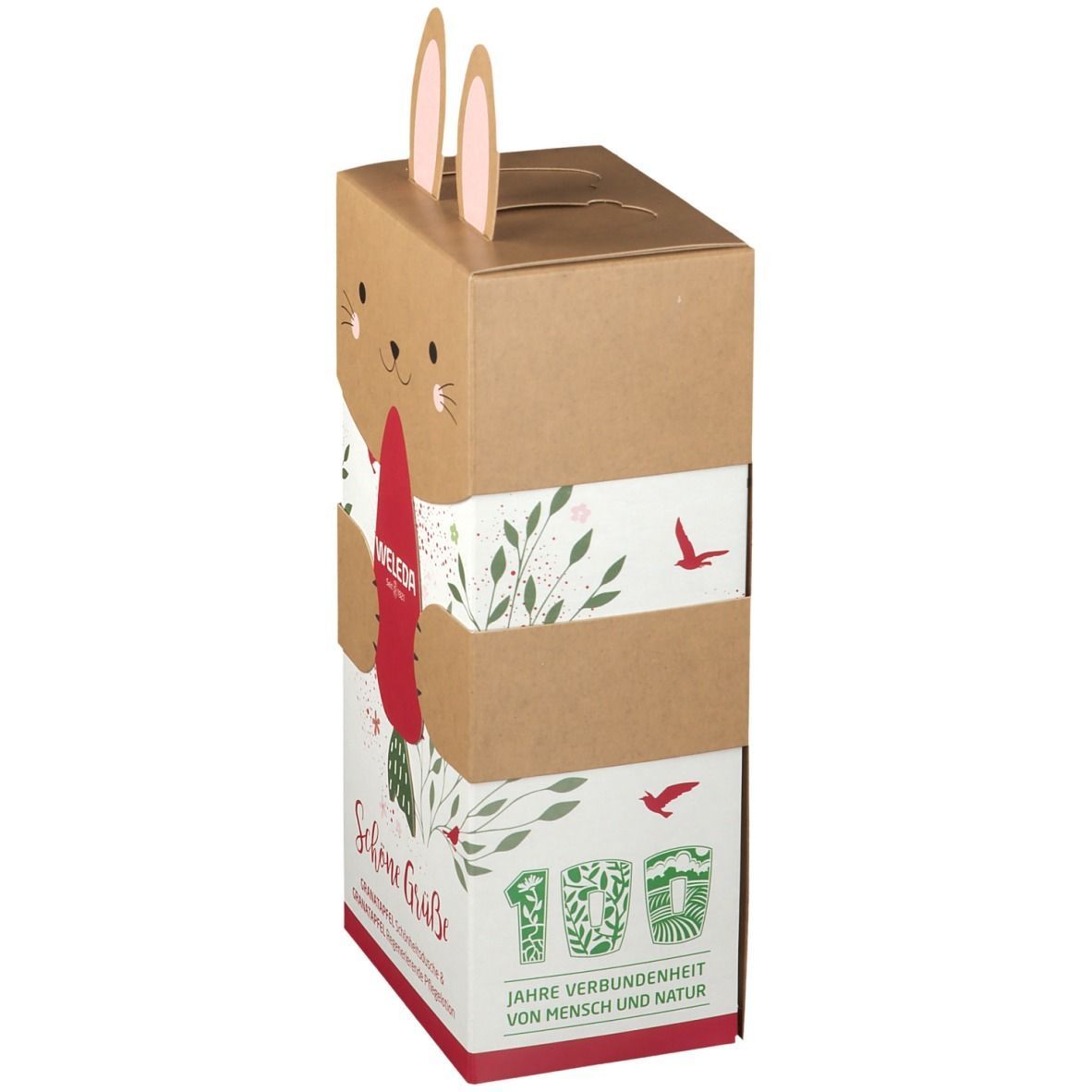 Kartonverpackung mit Hasenmotiv. Enthält WELEDA-Produkte. Aufschrift: Schöne Grüße, Granatapfel. 100 Jahre Verbundenheit.