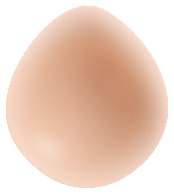 Ovale Brustprothese in Hautfarbe. Form: Tropfenförmig. Material: Silikon. Keine weiteren Merkmale sichtbar.