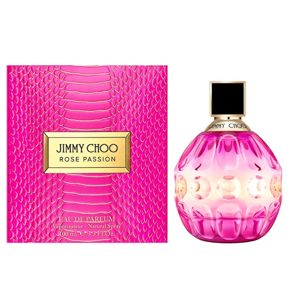 Rosa Flakon mit schwarzem Deckel und goldener Schrift. Daneben eine rosa Schachtel mit goldener Schrift.