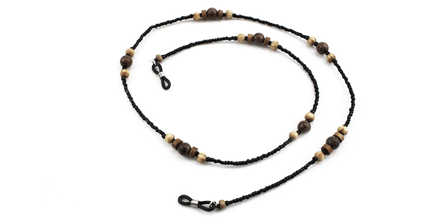 Brillenkette mit schwarzen Perlen und Holzperlen. Die Kette hat Schlaufen zum Befestigen an Brillenbügeln.
