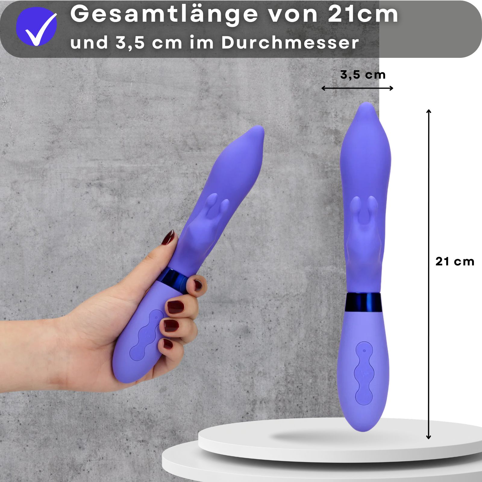 Lila Vibrator. Abmessungen: 21 cm lang, 3,5 cm Durchmesser. Gehaltene Hand. Maße in cm angegeben.