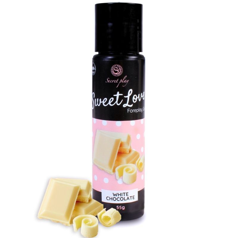 Schwarze Flasche mit weißem Etikett. Sweet Love Foreplay Gel. Abbildung von weißer Schokolade. Weiße Schokoladenstücke.
