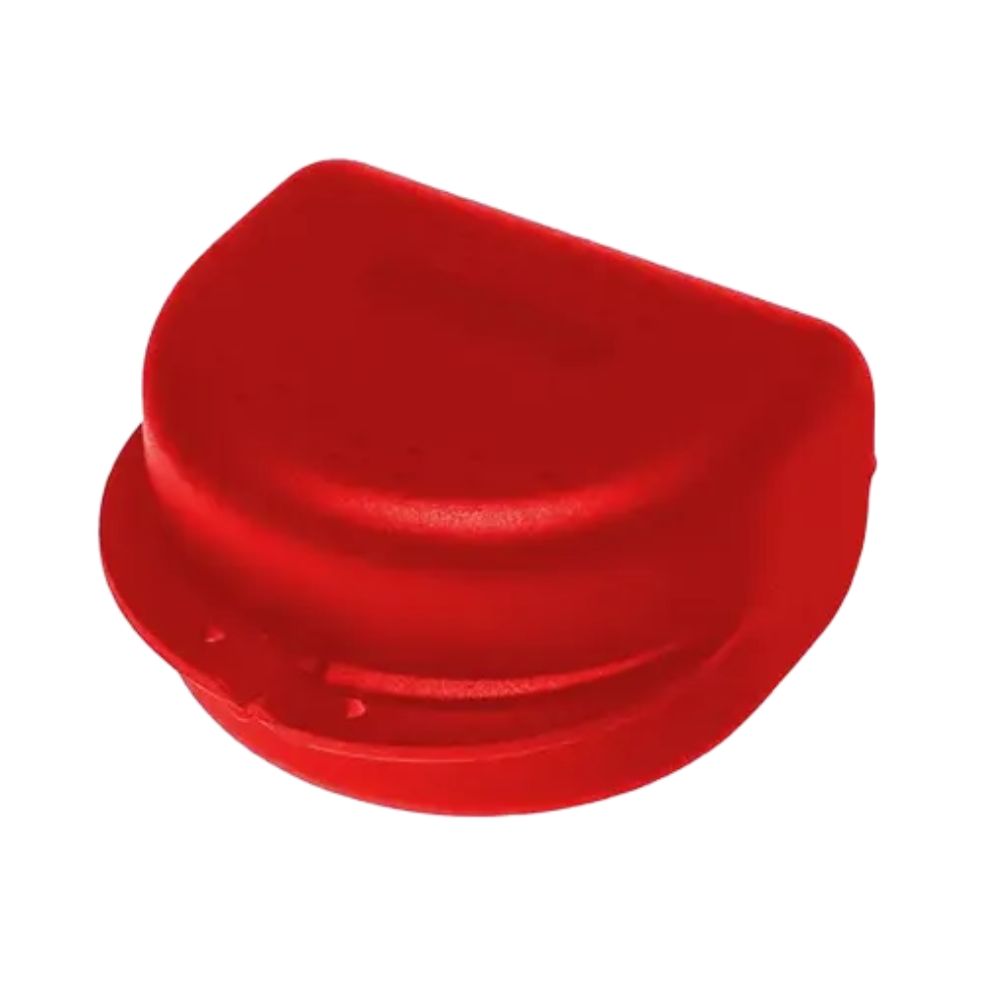 Rote, halbrunde Zahnspangenbox. Kunststoff, mit umlaufendem Rand. Zwei kleine Löcher an der Unterseite.