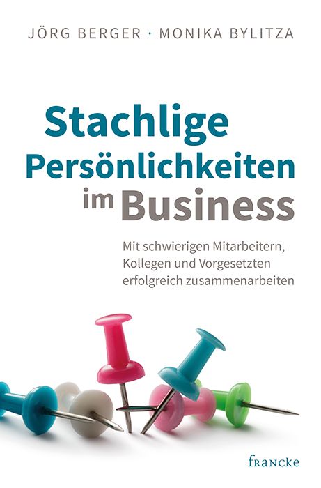 Buchcover mit Titel "Stachlige Persönlichkeiten im Business". Autoren: Jörg Berger, Monika Bylitza. Mehrere Reißzwecken.