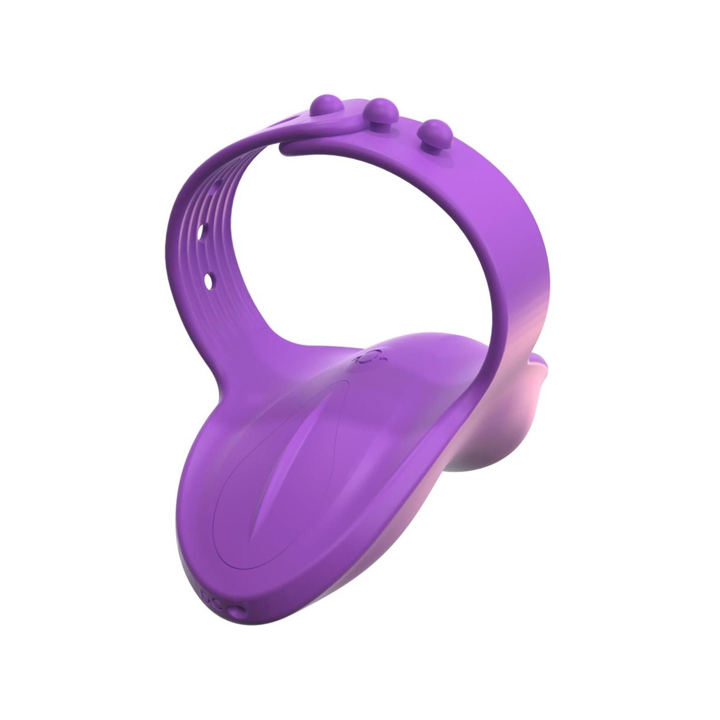 Lila Finger-Vibe. Ringförmiger Teil mit drei Erhebungen und Löchern. Unterteil mit abgerundeter Form.