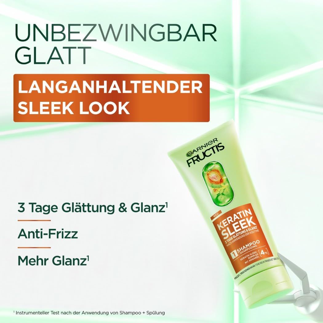 Garnier Fructis Keratin Sleek Shampoo. Grüne Tube mit Produktnamen und Angaben zu Glättung und Anti-Frizz.