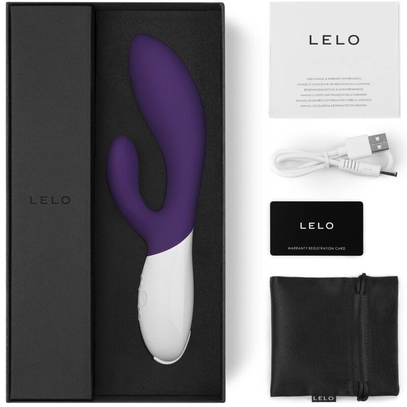 Geöffnete Verpackung mit Vibrator, Zubehör und Text. Marke LELO. Produktname INA 2. USB-Kabel, Beutel, Karte.