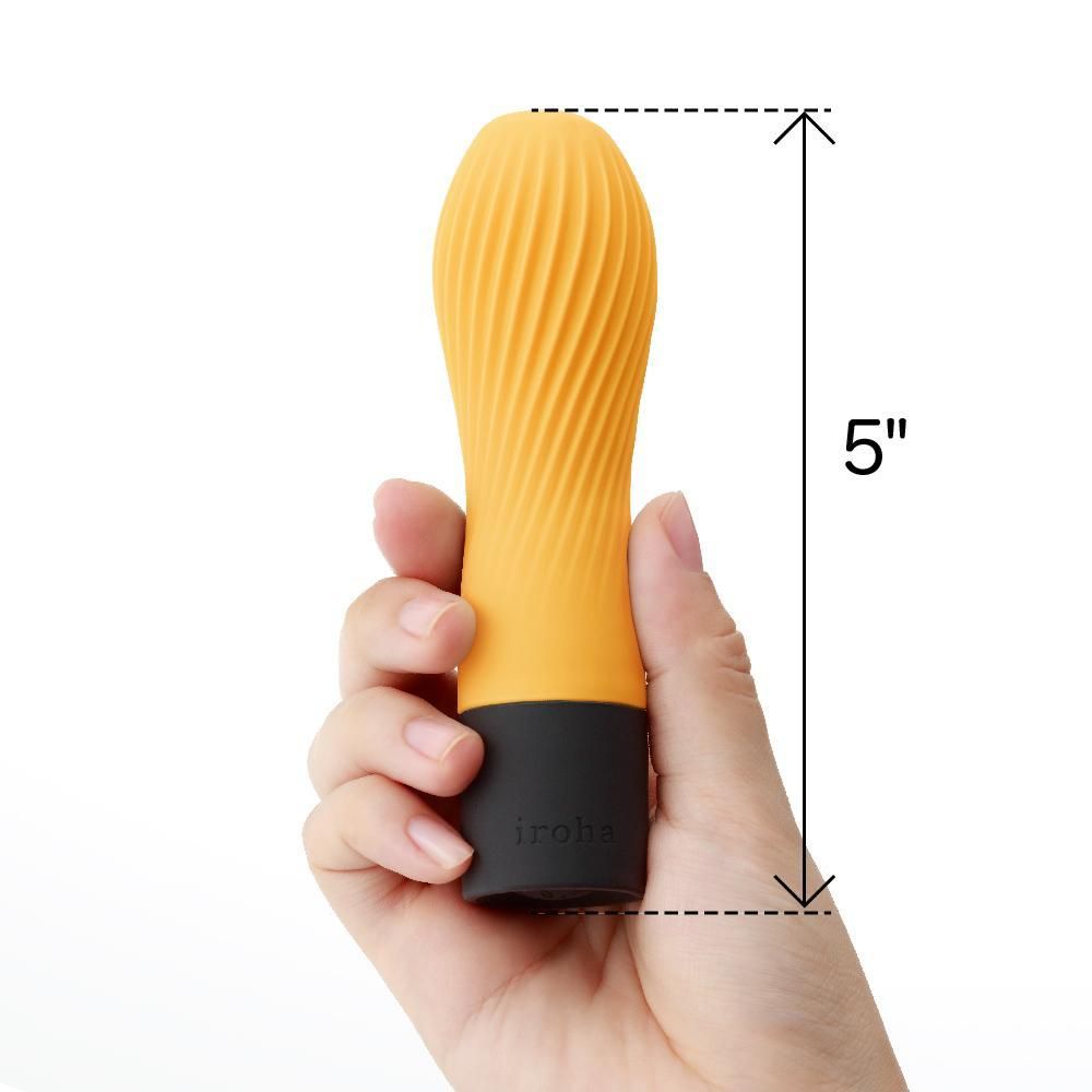 Gelber Vibrator, 5 Zoll hoch, in einer Hand gehalten. Schwarzer Sockel mit "iroha".