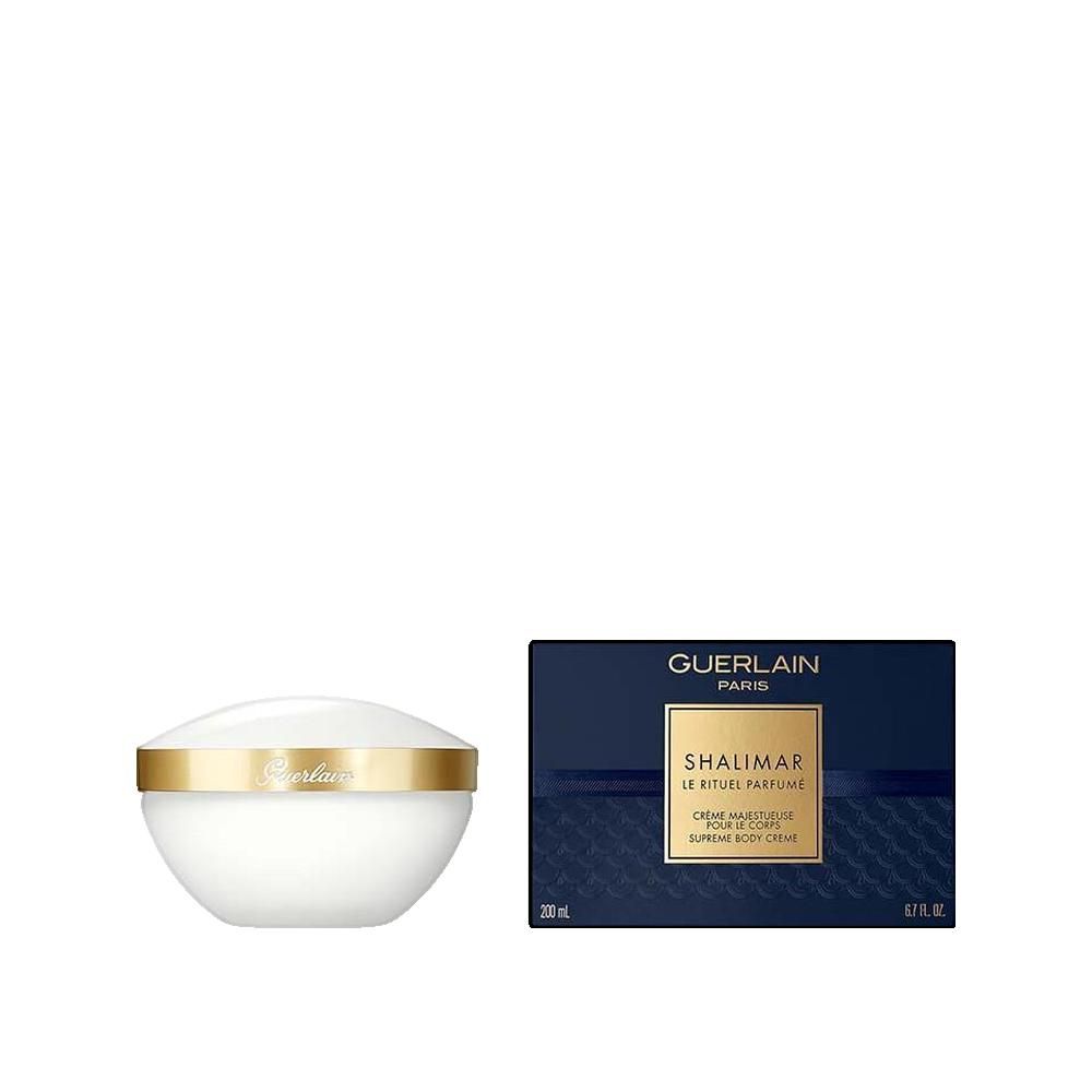 Weißer Tiegel mit goldenem Rand und Schriftzug. Blaue Schachtel mit Produktnamen und Logo.