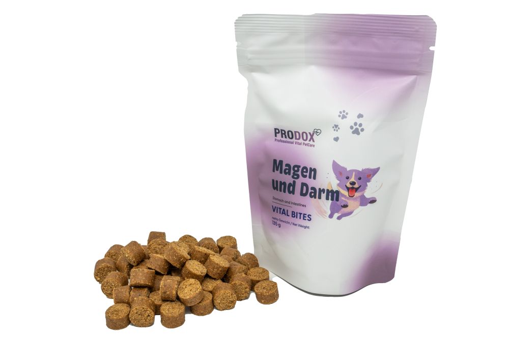 PRODOX Vital Bites Magen und Darm. Beutel und Haufen von kleinen, zylindrischen Bites. Produktname und Logo sichtbar.