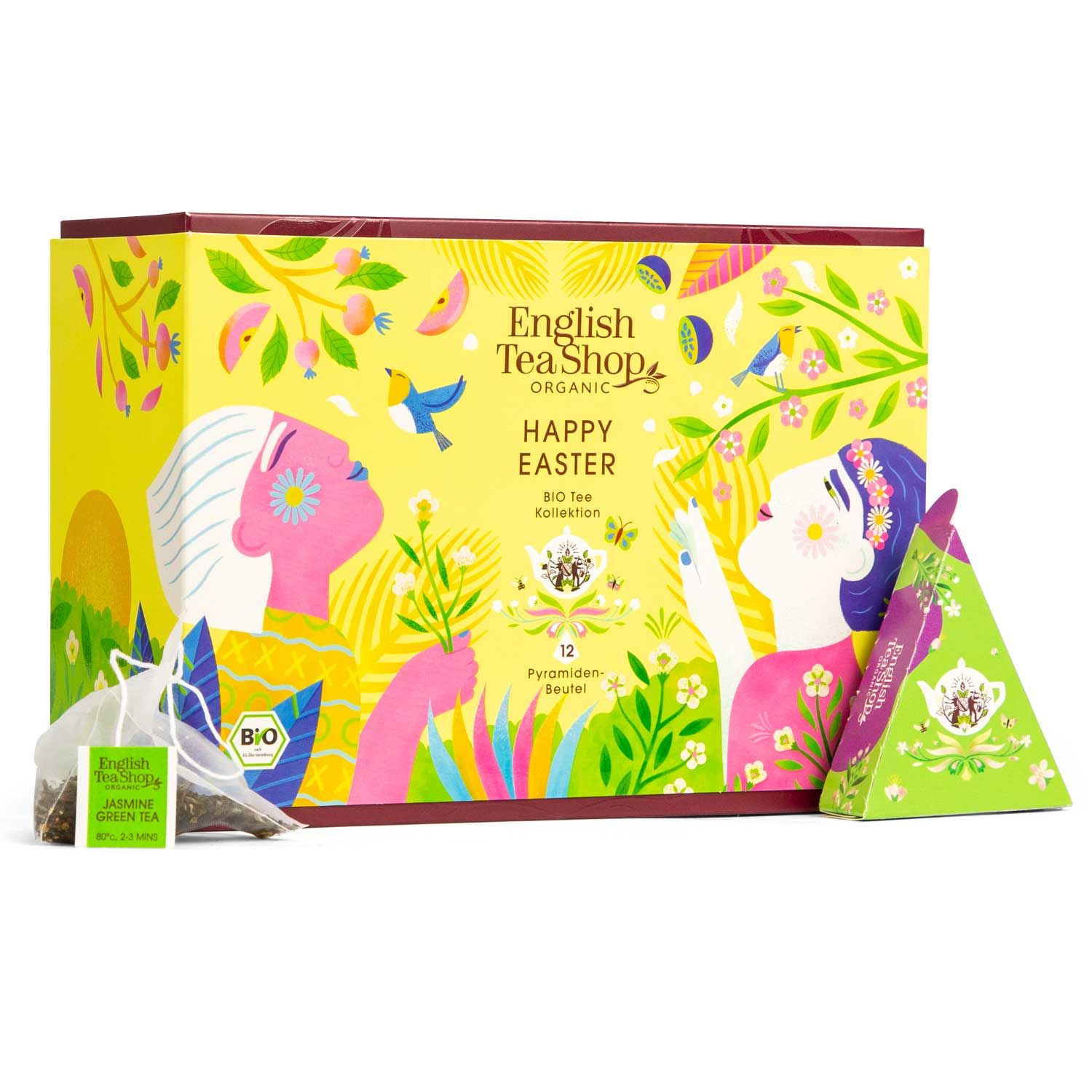 Gelbe Schachtel mit "Happy Easter" und "English Tea Shop" Logo. Enthält Teebeutel und pyramidenförmige Verpackungen.