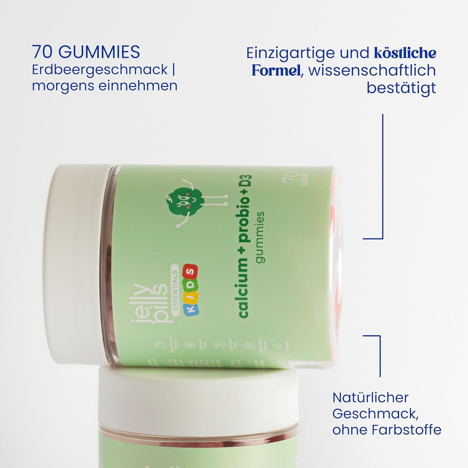 Zwei Gläser mit 'Jelly Pills Essentials Kids Calcium + Probio + D3 Gummies'. Text: 70 Gummies, Erdbeergeschmack, morgens einnehmen.