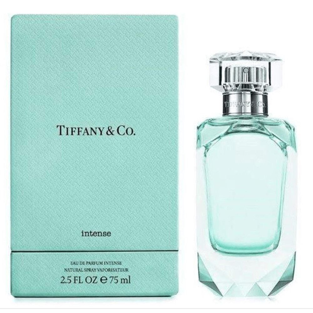 Türkisfarbene Schachtel und Flakon. Flakon mit Facettenschliff, silbernem Verschluss. Auf der Schachtel steht Tiffany & Co.