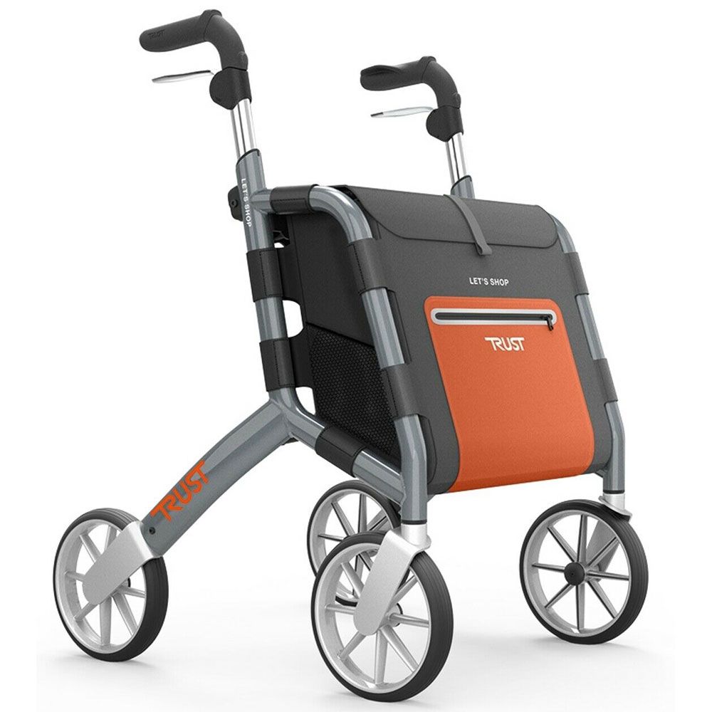 Rollator mit grauem Rahmen, orangefarbener Tasche und vier Rädern. Auf der Tasche steht "LET'S SHOP" und "TRUST".