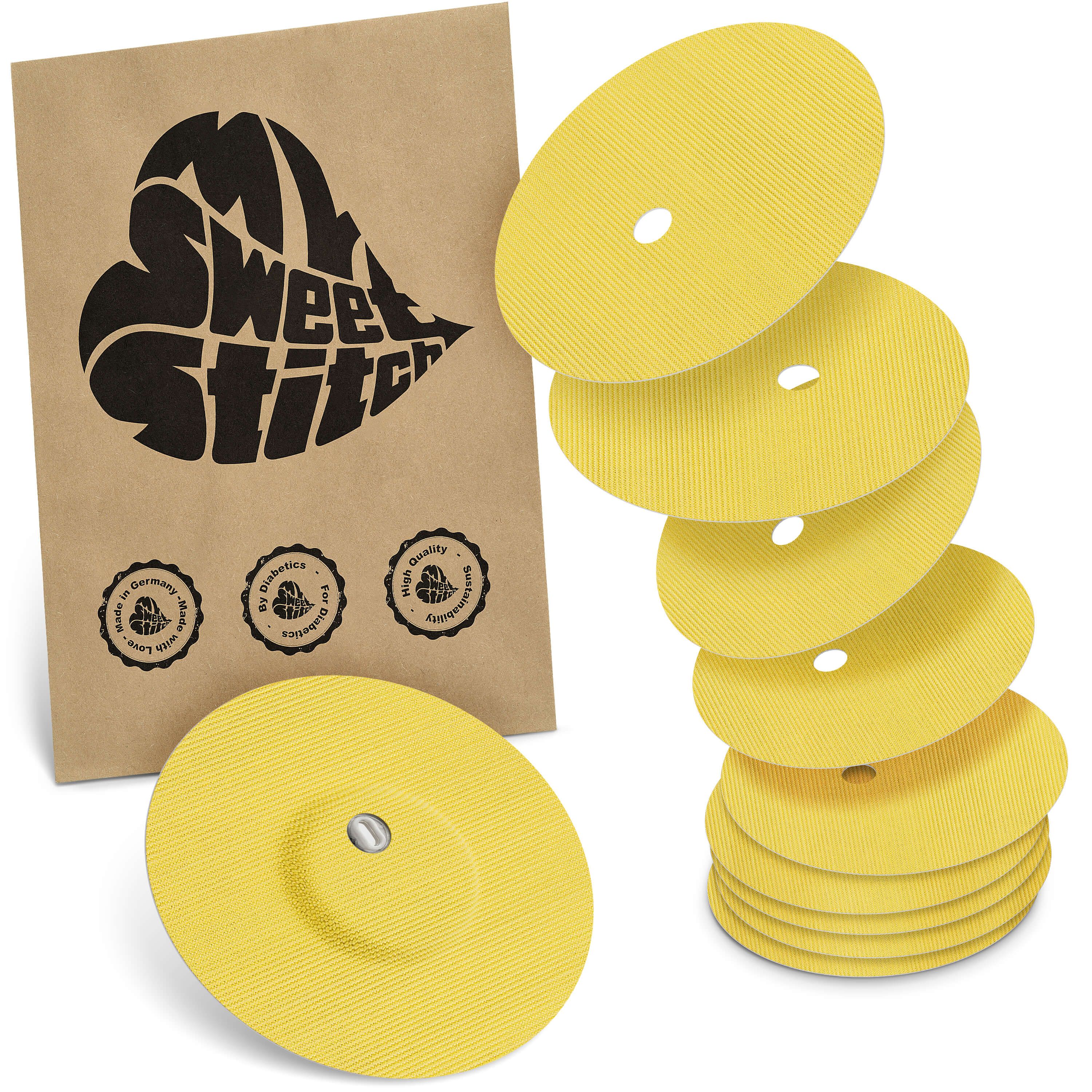 Gelbe Pflaster mit Belüftungsloch und braune Verpackung mit Logo. Mehrere Pflaster gestapelt und einzeln.