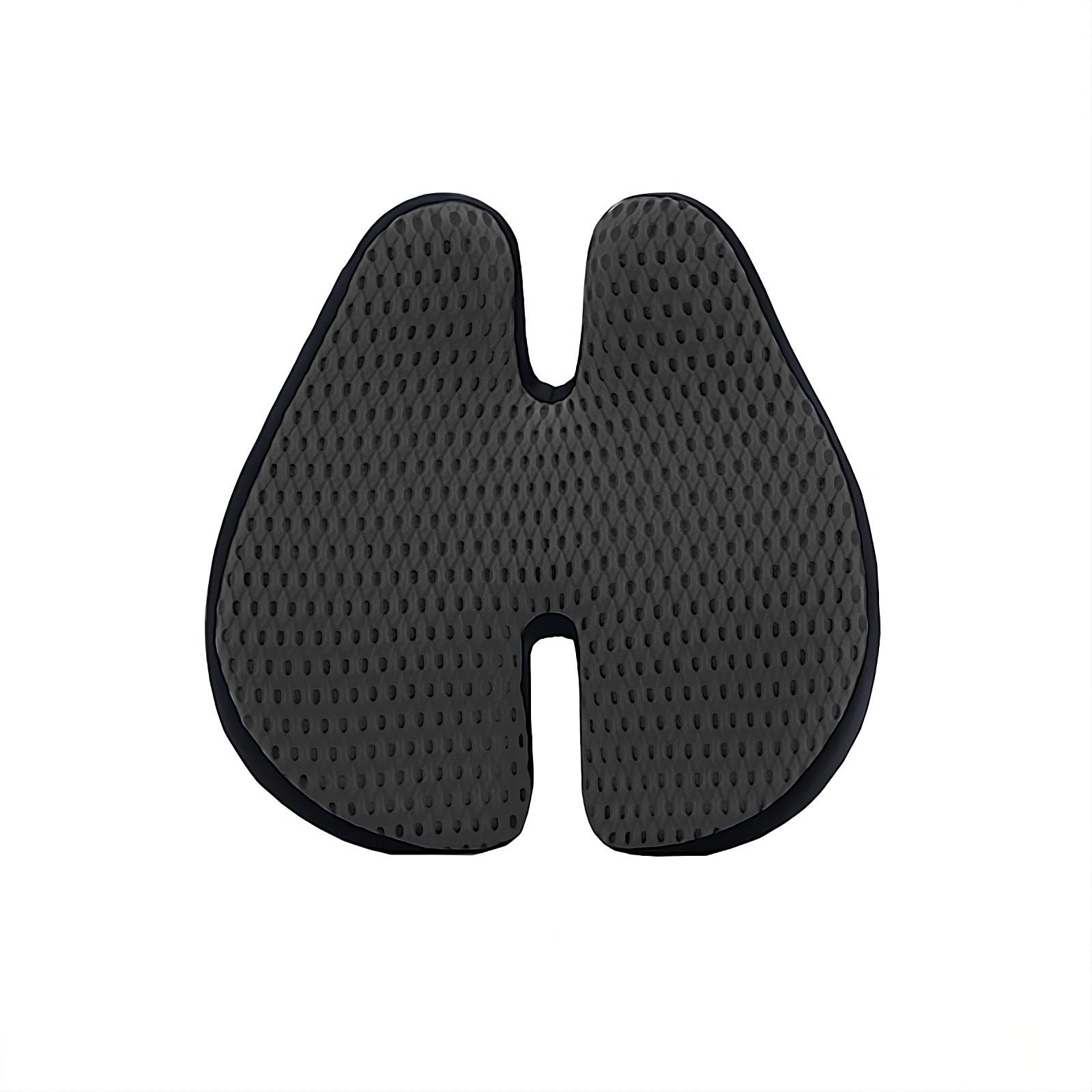 Ergonomisches schwarzes Sitzkissen mit U-förmiger Aussparung und wabenartiger Oberfläche.