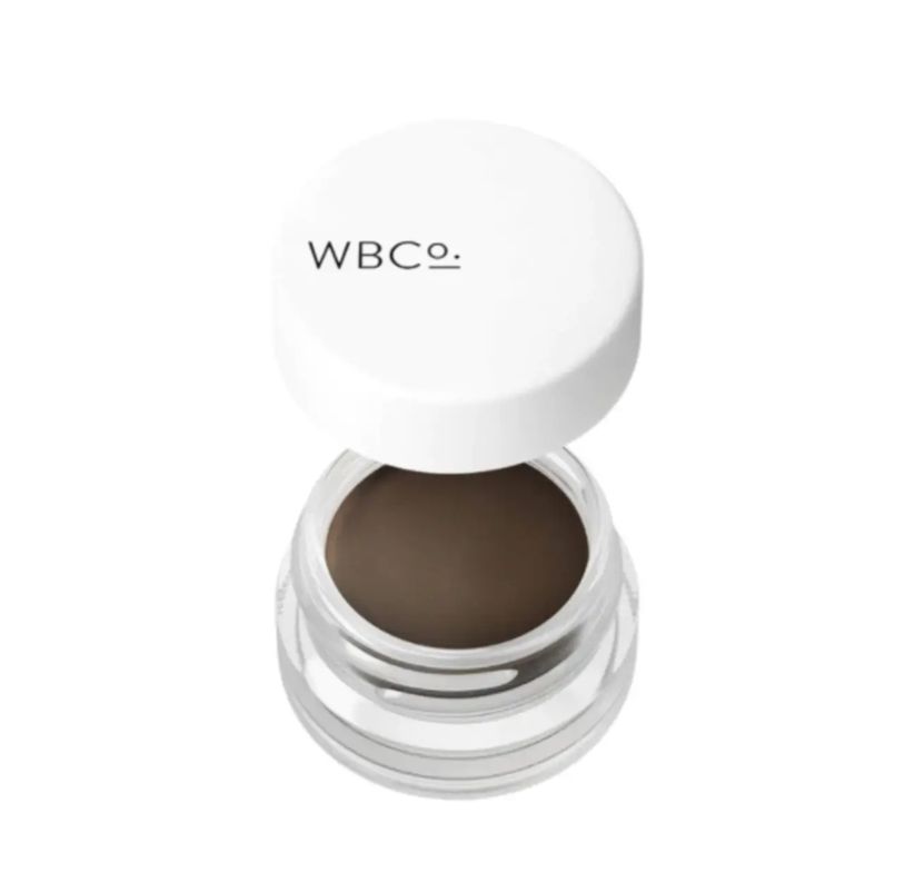 Brauenpomade in einem transparenten Glas mit weißem Deckel. Auf dem Deckel steht "WBCo.".