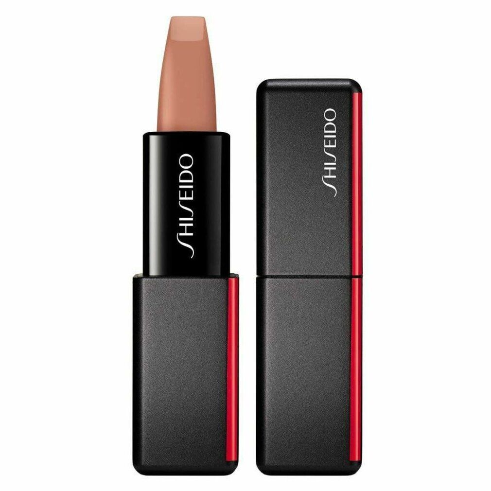 Lippenstift mit schwarzem Gehäuse und rotem Akzent. Der Lippenstift ist hellbraun. Auf dem Gehäuse steht „SHISEIDO“. Der Deckel liegt daneben.