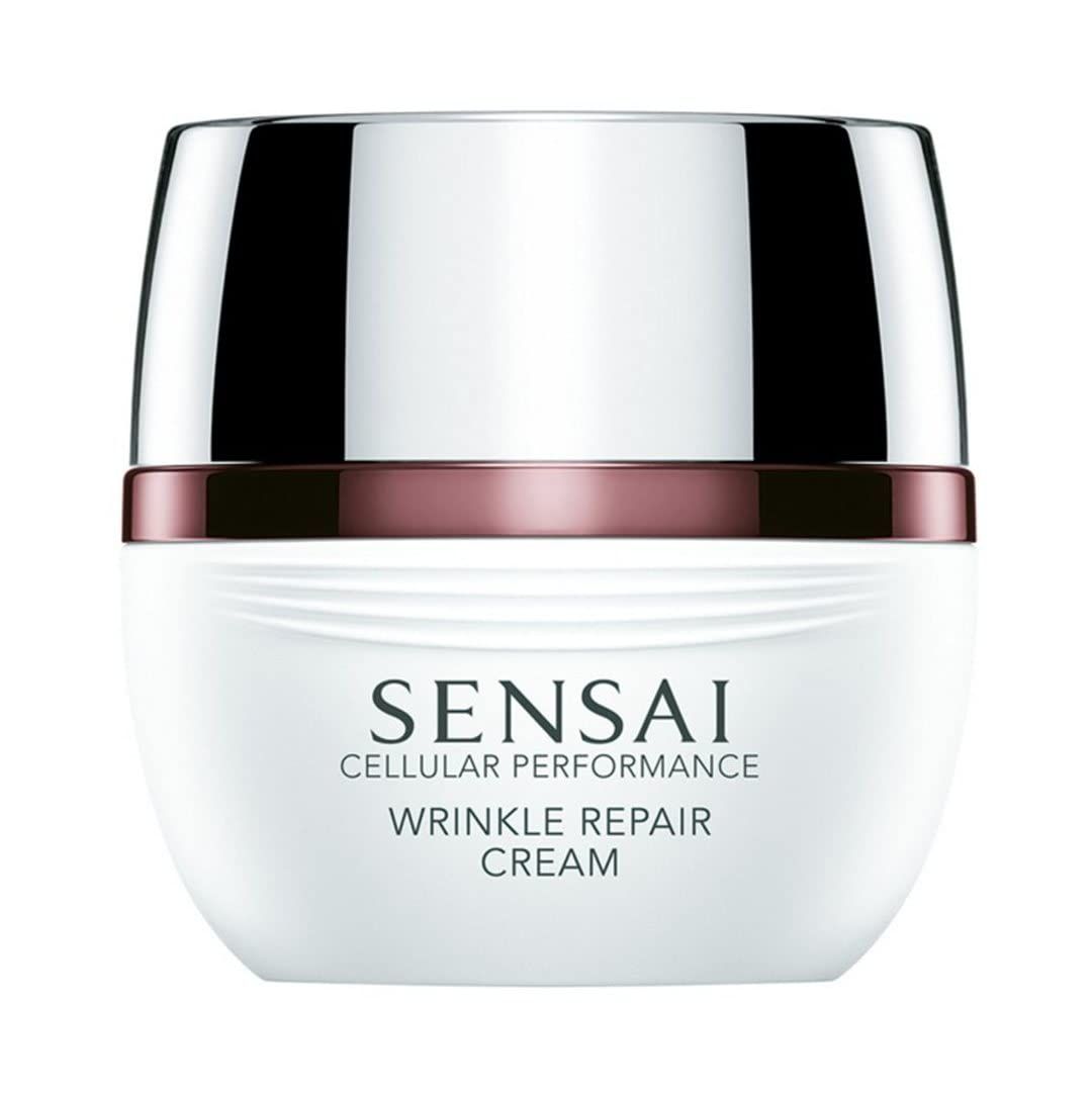Weißer Tiegel mit silbernem Deckel und rotem Ring. Aufschrift: SENSAI CELLULAR PERFORMANCE WRINKLE REPAIR CREAM.