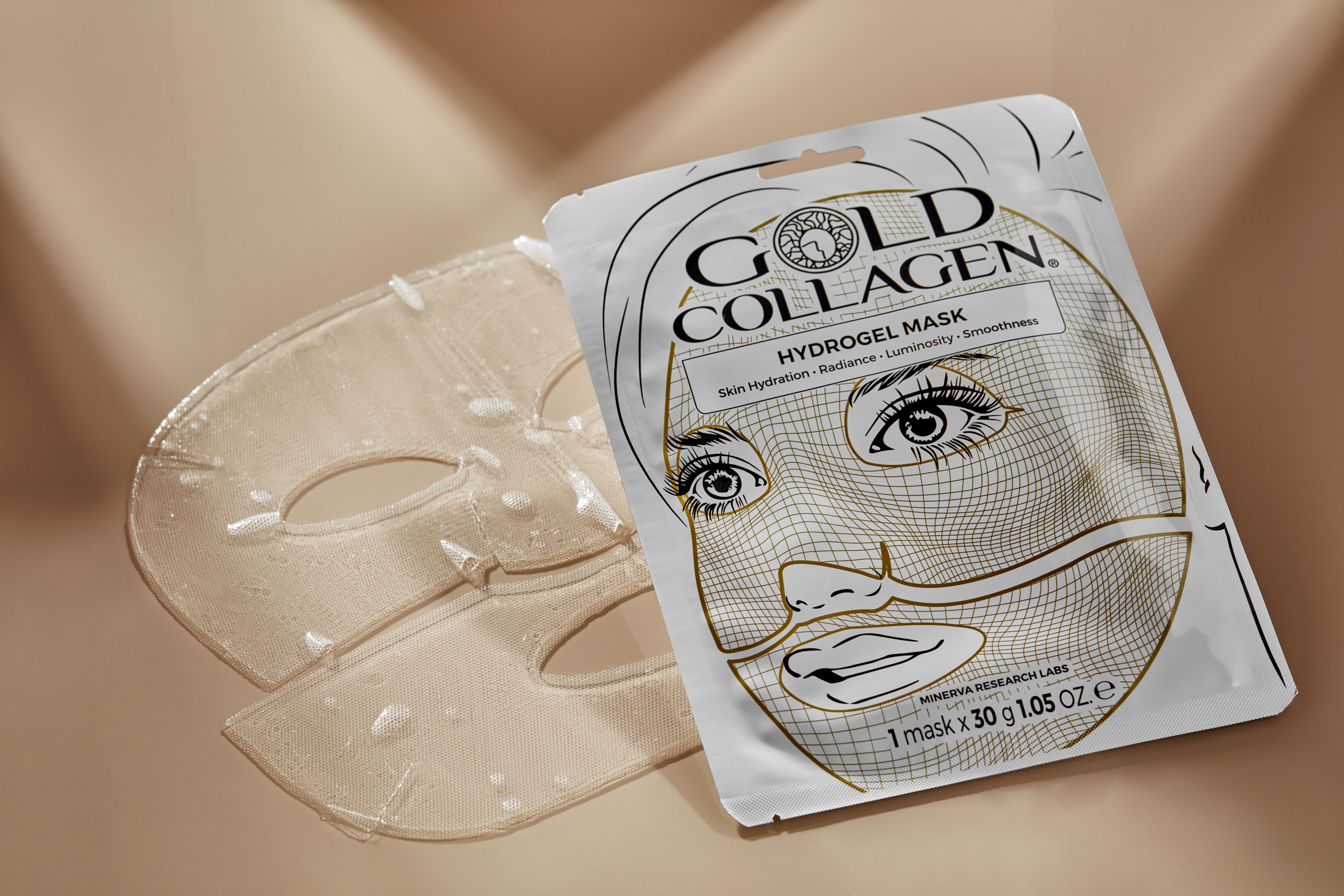 Gold Collagen Hydrogel Maske-Verpackung und eine Maske daneben. Weißes Päckchen mit Gesichtsskizze. Text: Hydrogel Mask.