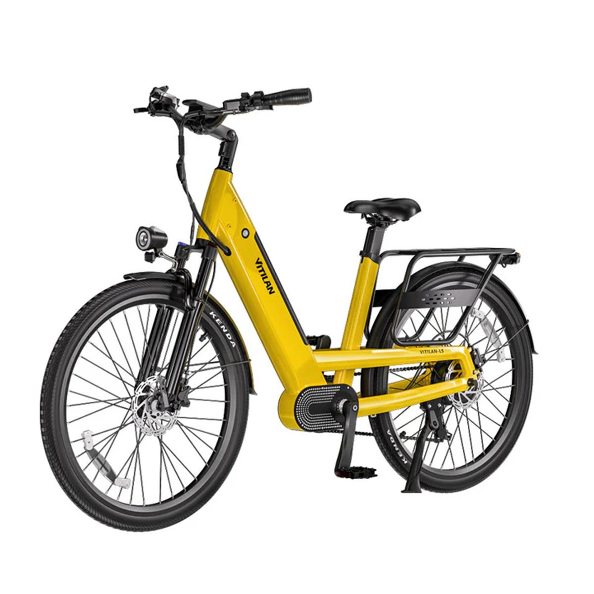 Gelbes Vitilan L5 E-Bike. Schwarze Reifen, Gepäckträger, Scheinwerfer. Kenda-Reifenbeschriftung.