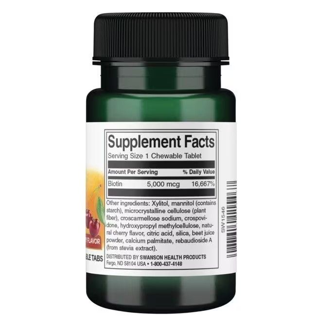 Rückseite der grünen Flasche. Etikett mit Nährwertangaben für "Biotin 5.000 mcg". Zutatenliste und Herstellerinformationen.