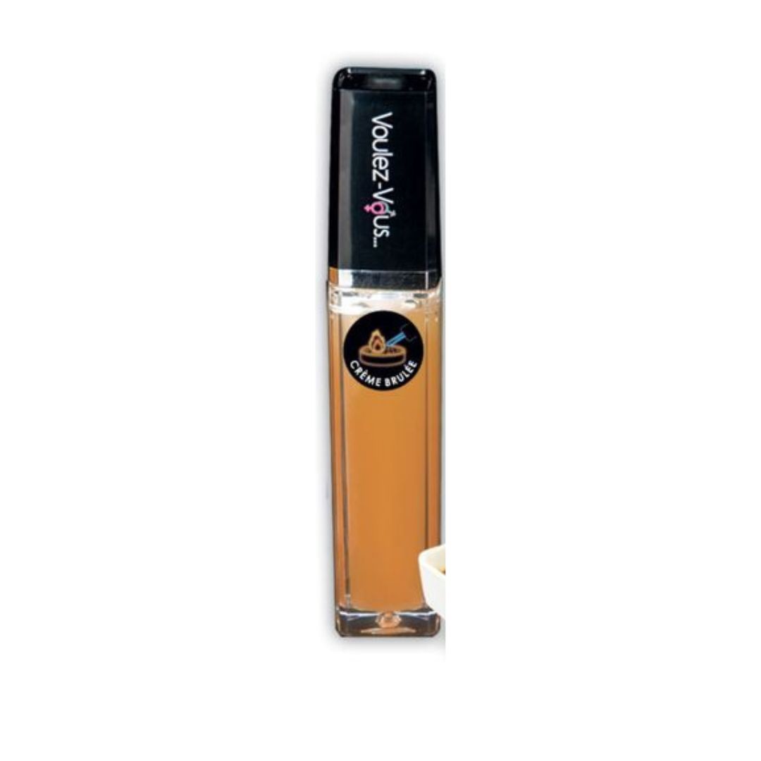 Lucidalabbra in custodia rettangolare trasparente con tappo nero. Scritta: Voulez-Vous. Etichetta: Crème Brûlée.