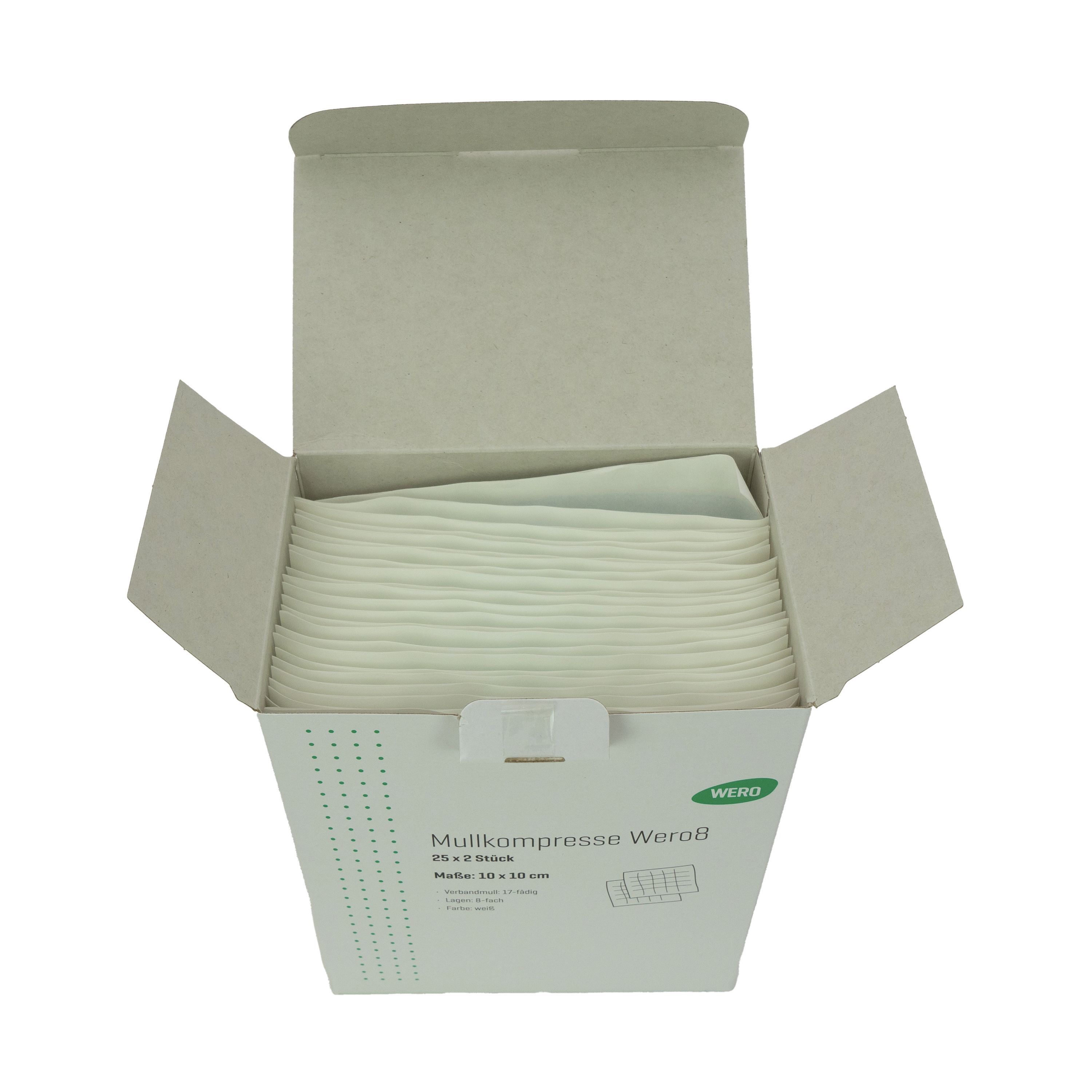 Geöffnete Kartonage mit Mullkompressen. Innenliegende Kompressen, weiß. Auf der Verpackung: Mullkompresse Wero8, 25 x 2 Stück, Maße 10 x 10 cm.