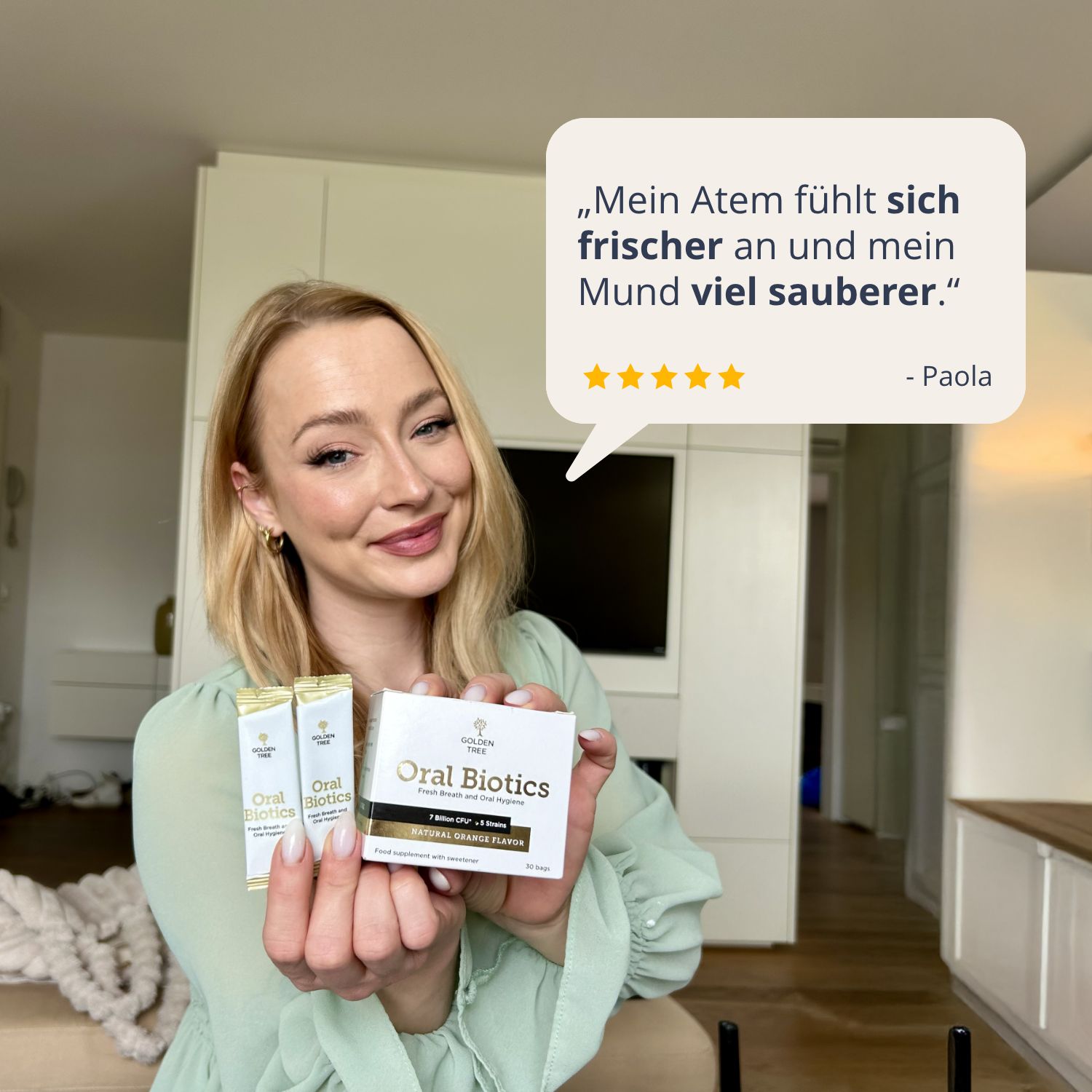Frau mit Golden Tree Oral Biotics. Zitat: 'Mein Atem fühlt sich frischer an'.
