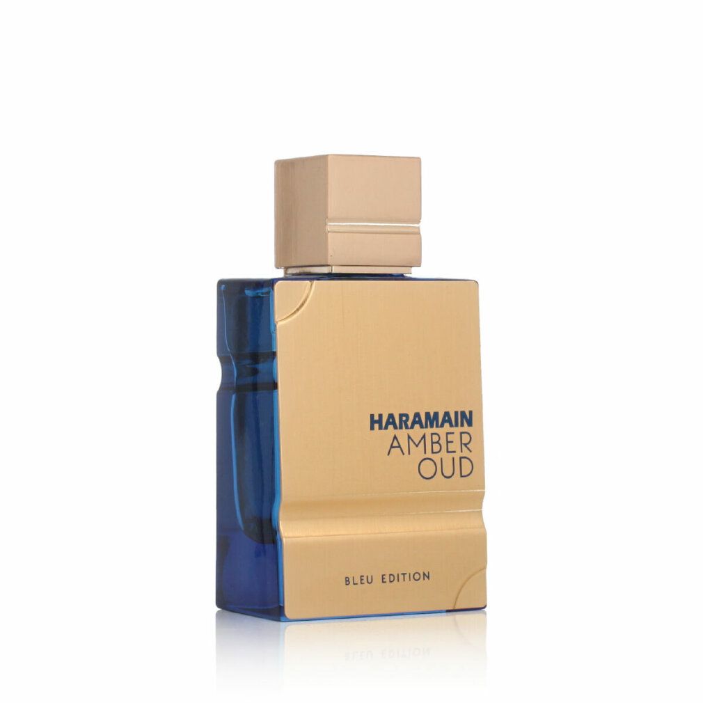 Goldfarbene Parfümflasche mit goldfarbenem Deckel und blauer Basis. Produktname und Markenlogo sind sichtbar.