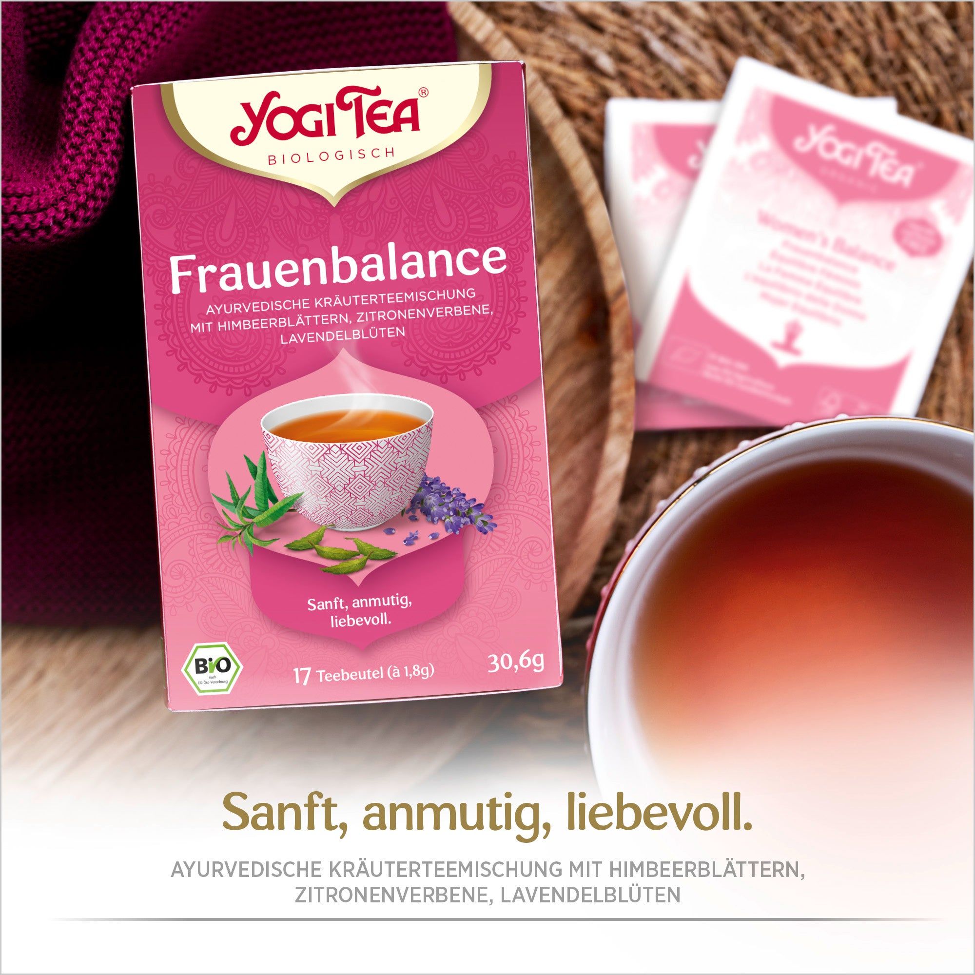 Yogi Tea - Frauenbalance Kräutertee. Rosa Verpackung, Logo, Text. Teebeutel und Tasse. Bio-Siegel. 17 Teebeutel.