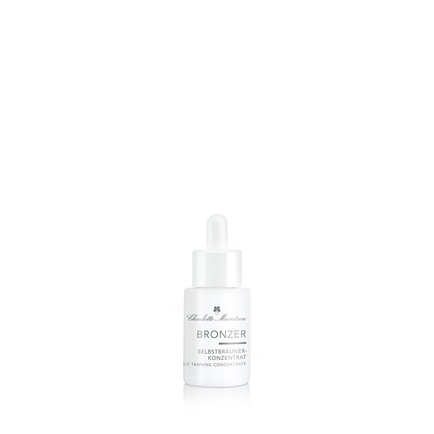 Weiße Flasche mit Pipette. Aufschrift: Bronzer Selbstbräuner-Konzentrat. Produktname und Marke.