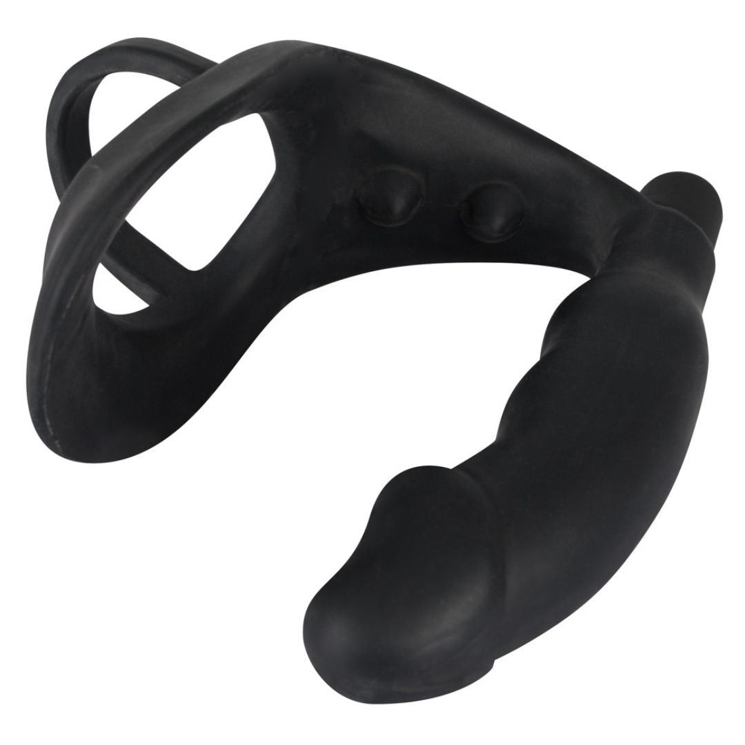 Schwarzer Penis-/Hodenring mit Analplug. Aus Silikon. Mit zwei Erhebungen und einem Ring.