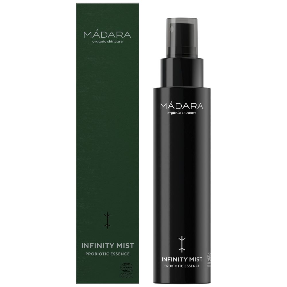 Schwarze Sprühflasche und grüne Verpackung. Aufschrift: MÁDARA, Infinity Mist, Probiotic Essence. Mit Sprühkopf.