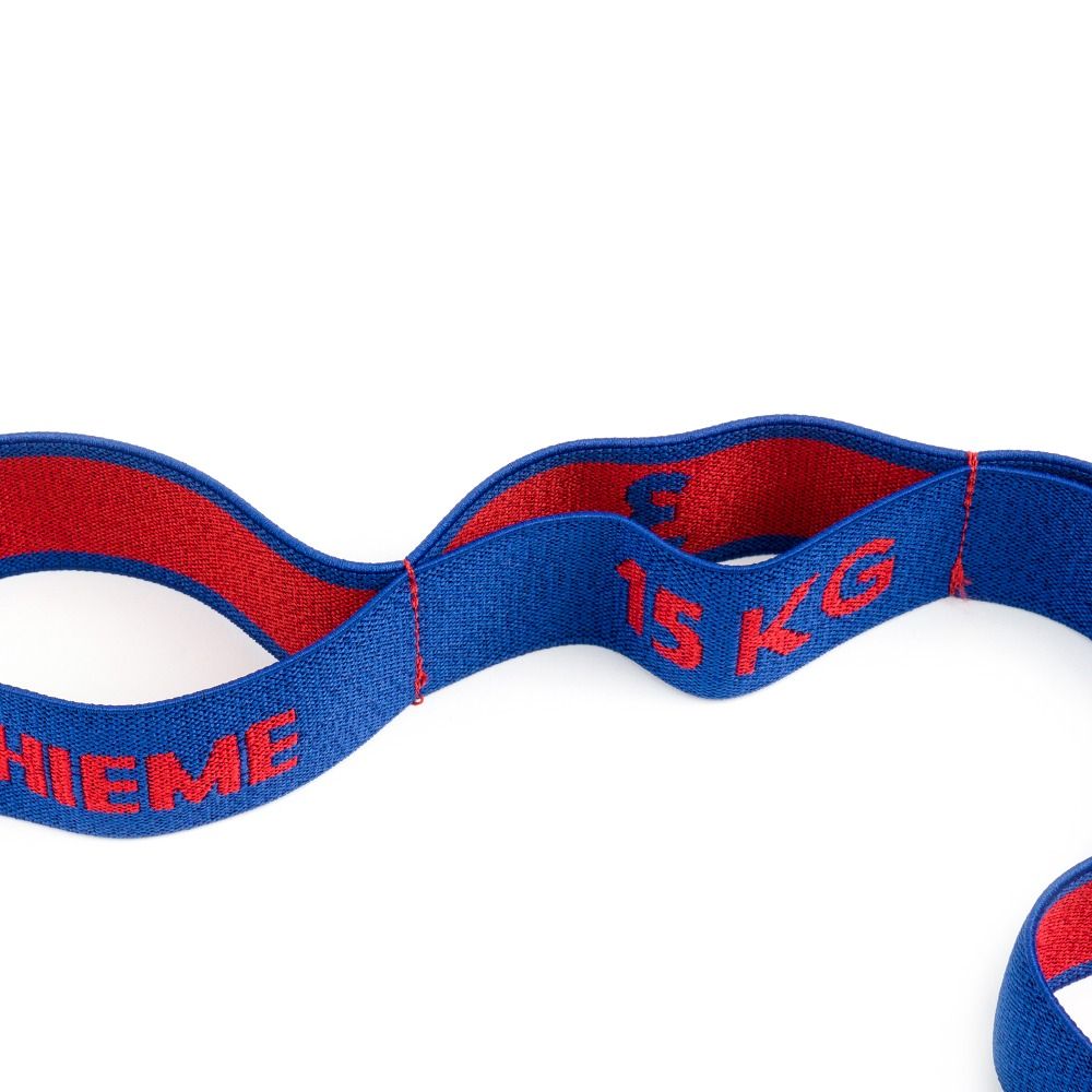 Nahaufnahme eines blauen Elastikbands mit roter Innenseite. Text: Sport-Thieme, 15 KG. Flex-Loop.