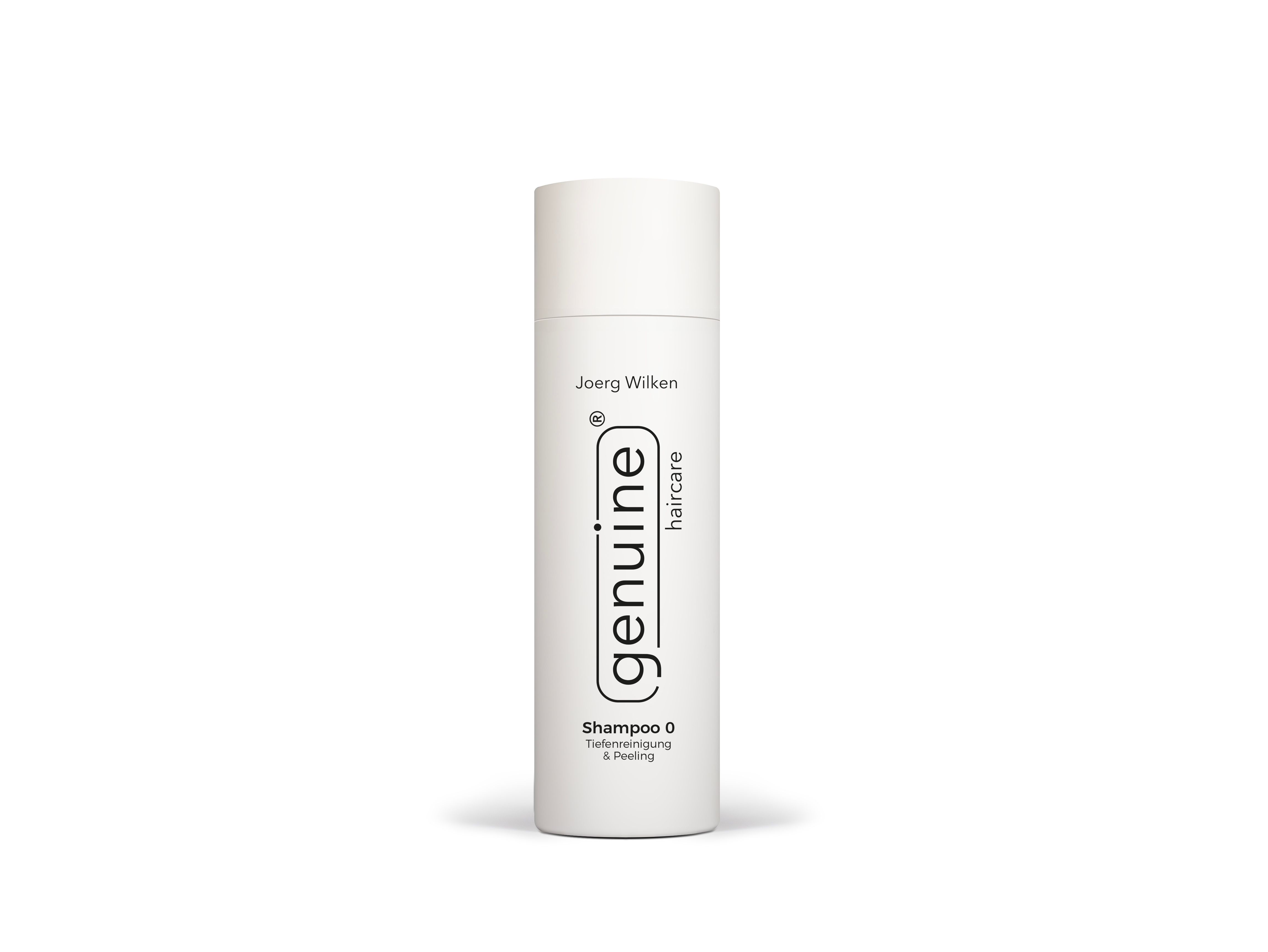 Weiße zylindrische Flasche mit Deckel. Aufschrift: genuine haircare, Shampoo 0 Tiefenreinigung & Peeling. Marke Joerg Wilken.