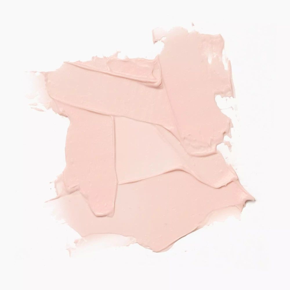 Rosa Lippenbalsam-Textur auf weißem Hintergrund. Unregelmäßige Form, cremige Konsistenz. Farbton und Textur sichtbar.