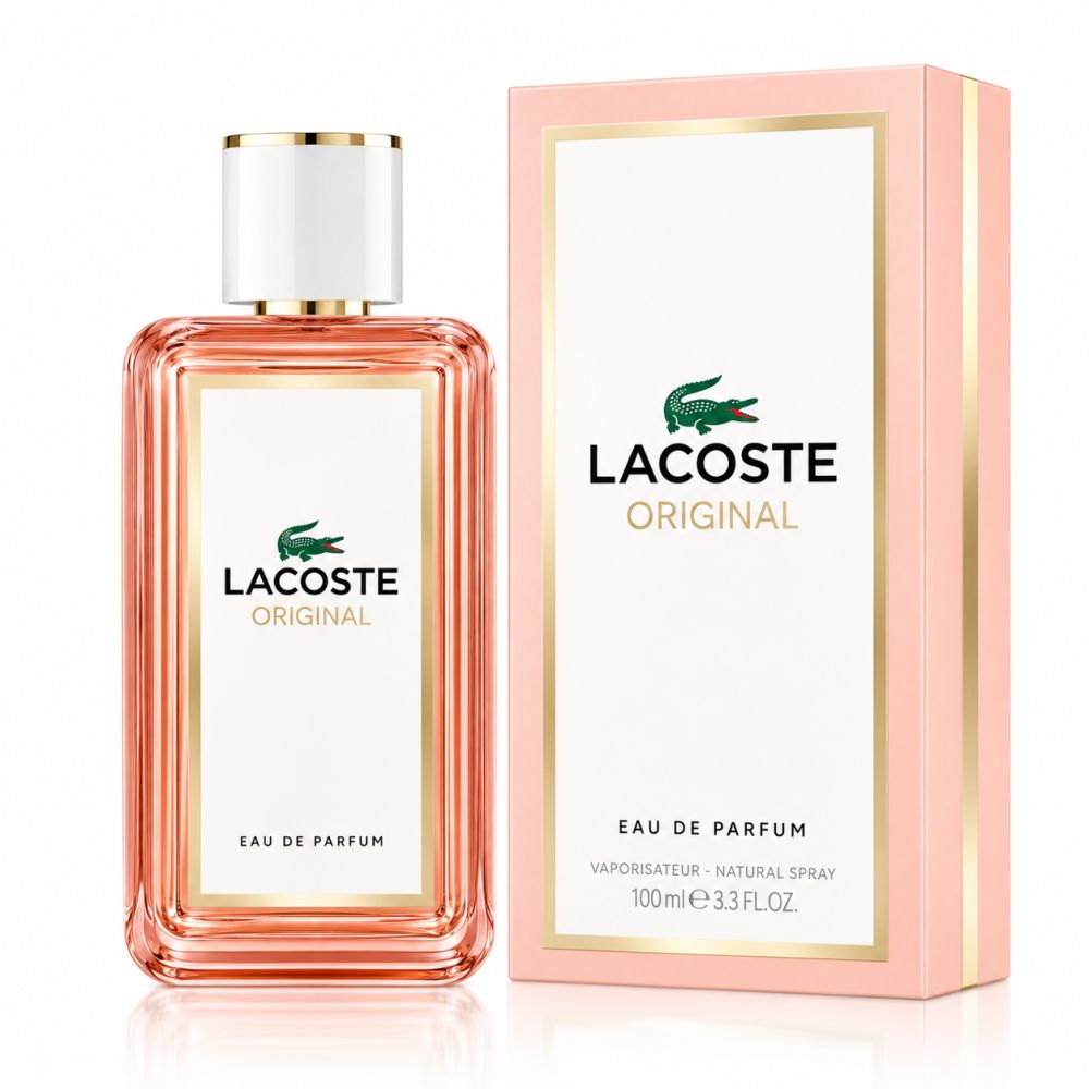 LACOSTE Original Femme EdP Nat. Spray Flakon und Verpackung. Rosa Karton mit weißem Etikett und goldenen Akzenten.
