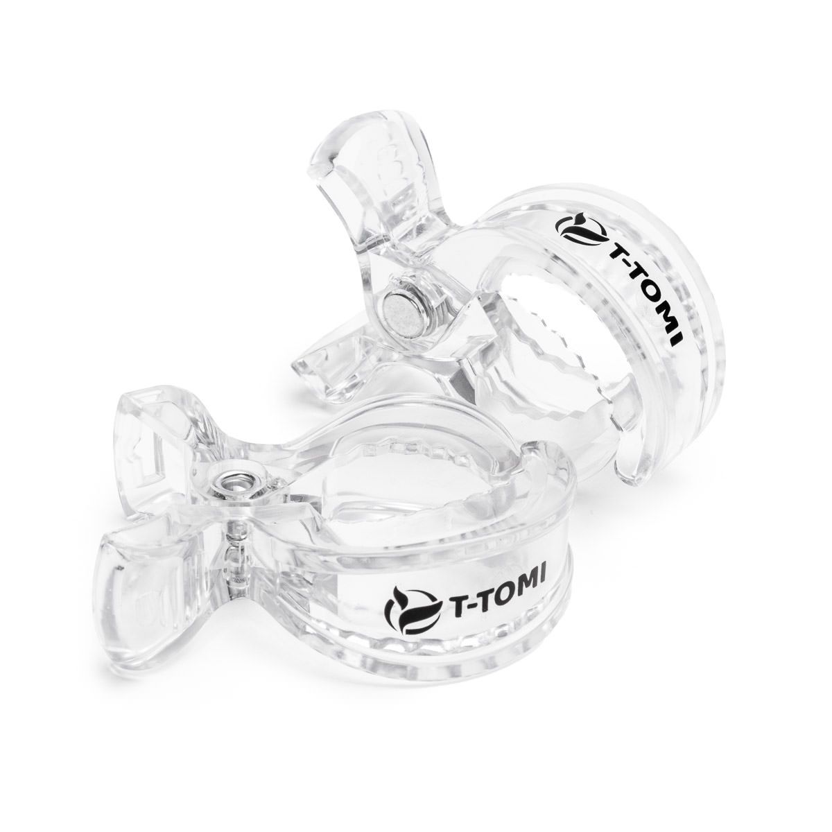 Zwei transparente T-Tomi Clips mit schwarzem Logo, auf weißem Hintergrund.