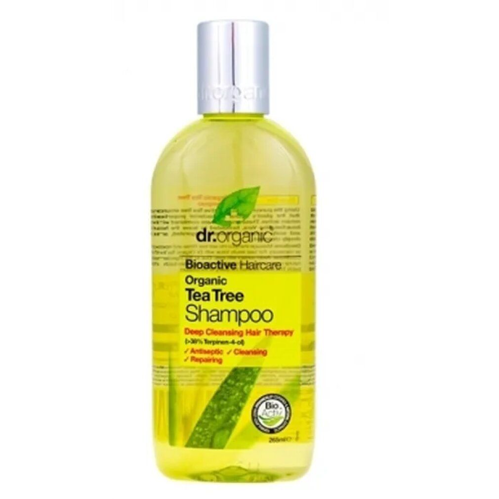 Dr. Organic Bio-Teebaum-Shampoo. Gelbe Flüssigkeit in einer Flasche mit silbernem Deckel. Aufschrift: Organic Tea Tree Shampoo.