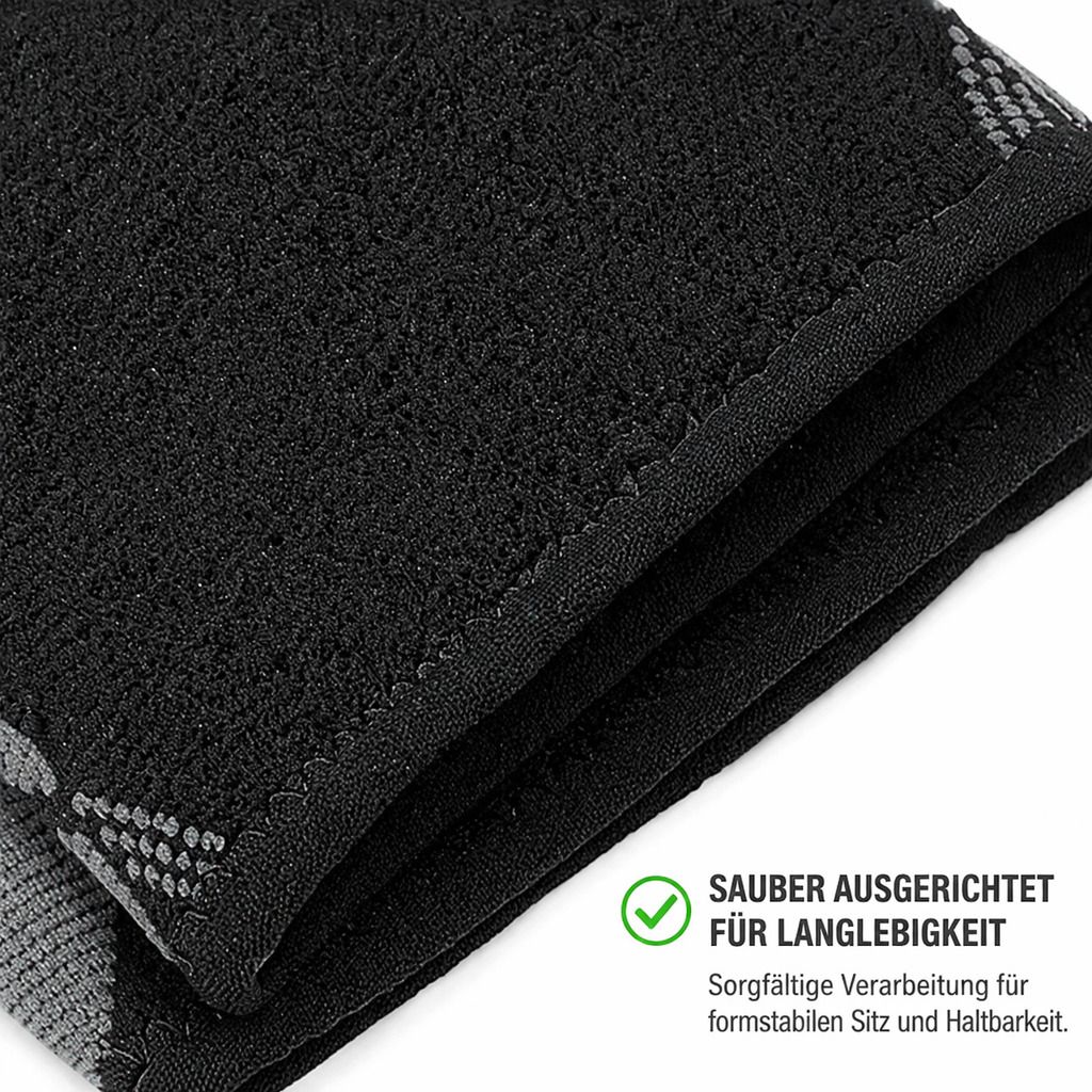 Nahaufnahme der schwarzen Ellenbogenbandage. Sorgfältige Verarbeitung für formstabilen Sitz und Haltbarkeit. Text: Sauber ausgerichtet.