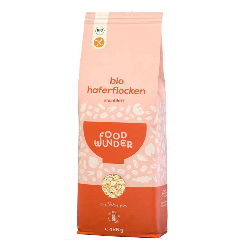 Rosa-orange Packung mit Bio-Haferflocken. Text: bio Haferflocken Kleinblatt, Food Wunder, von Natur aus, 425g. Mit Bio-Siegel und glutenfrei.